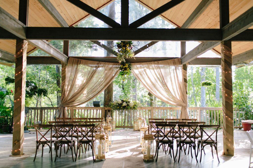The covered porch at Palmettos on the Bayou set for an intimate wedding ceremony.