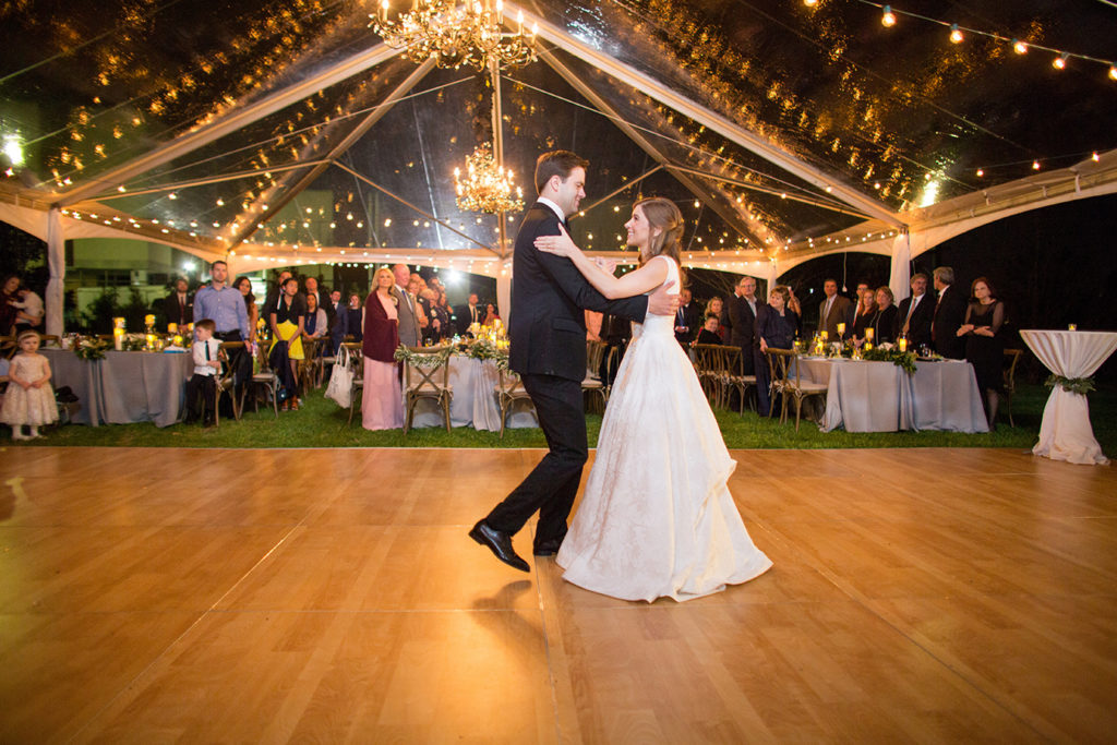 Wedding first dance under a clear tent | photo by Rob Garland Photography