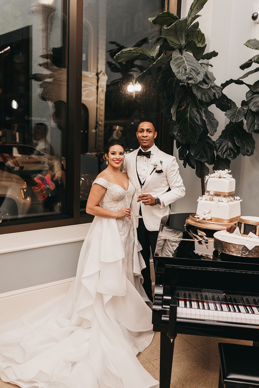 Melanie and Duke cut their wedding cake in the NOPSI Hotel lobby.