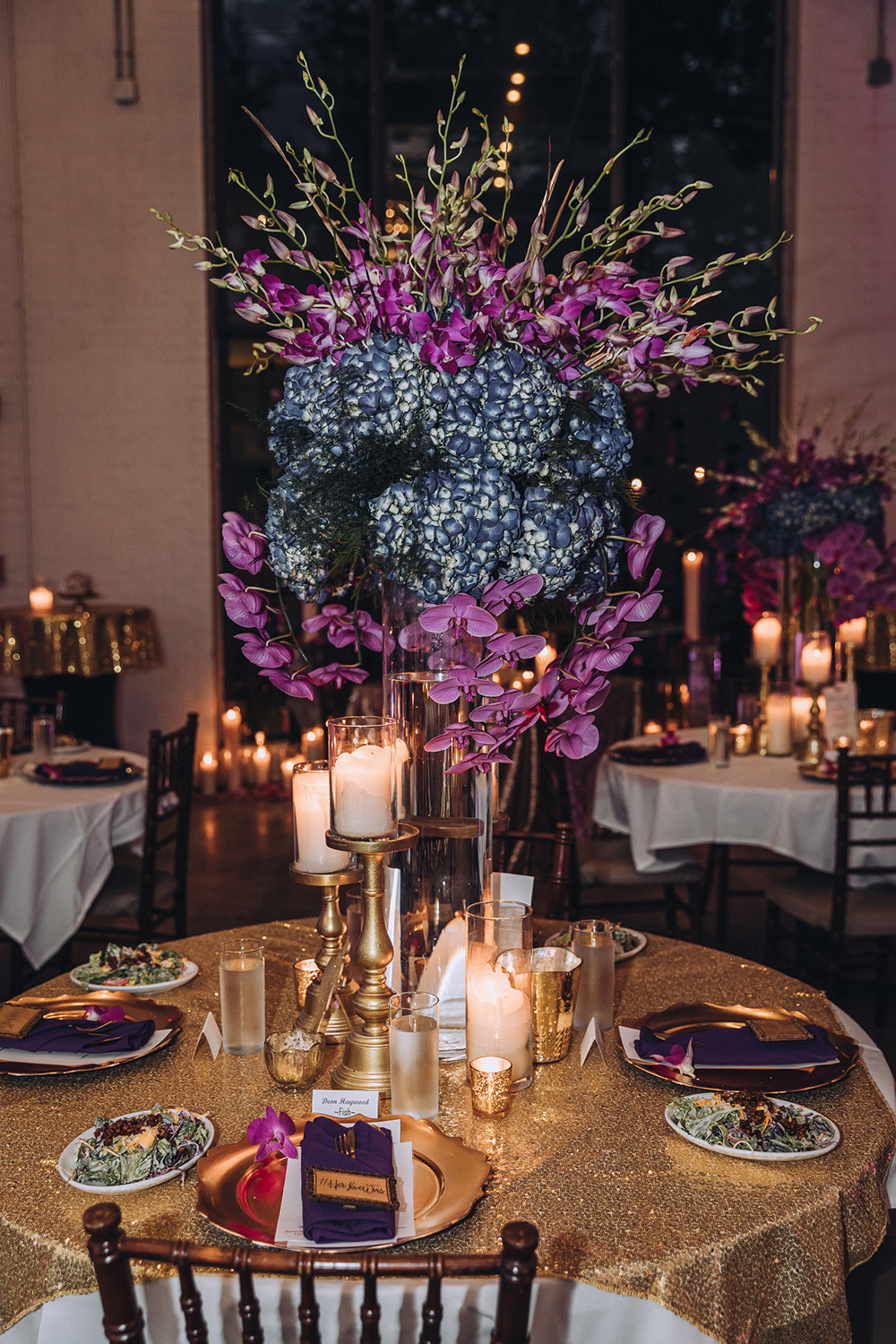 Pink and purple floral arrangements graced the reception tables.