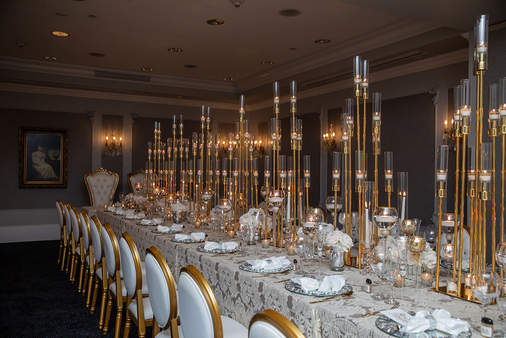 The engagement party dinner table with modern, elegant candelabra.