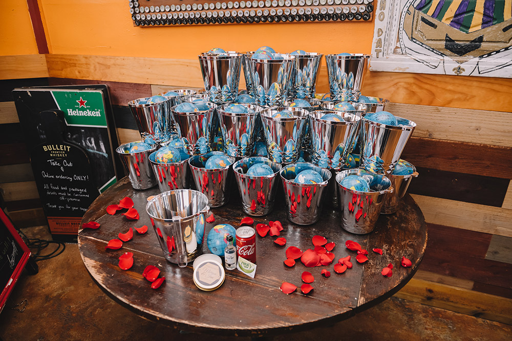 The wedding favors included miniature globes and NOLA-themed candles by Wicks NOLA. Photo: Rare Sighting Photography