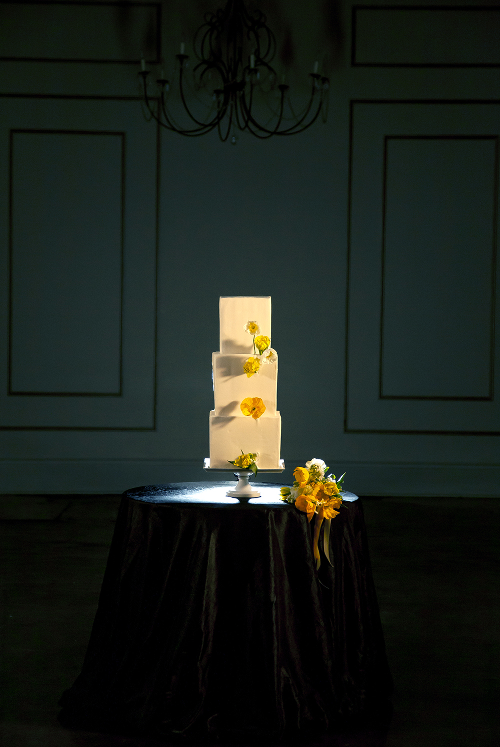 Wedding Cake by Gambino's Bakery with yellow poppies by Fat Cat Flowers.