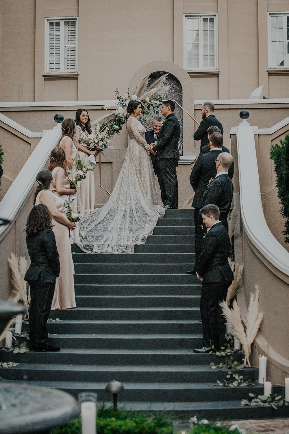 The wedding ceremony on the steps of the W French Quarter courtyard. Photo: Sara Ann Green Photography