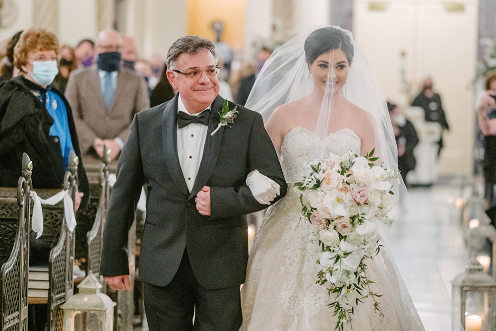 Francesca's father walks her down the aisle.