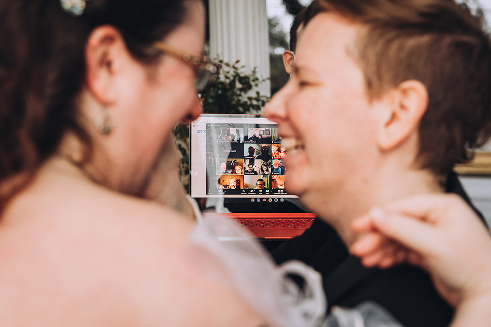 wedding guests celebrate virtually with the brides via livestream