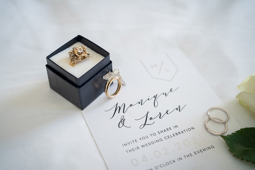 the wedding rings and wedding invitation