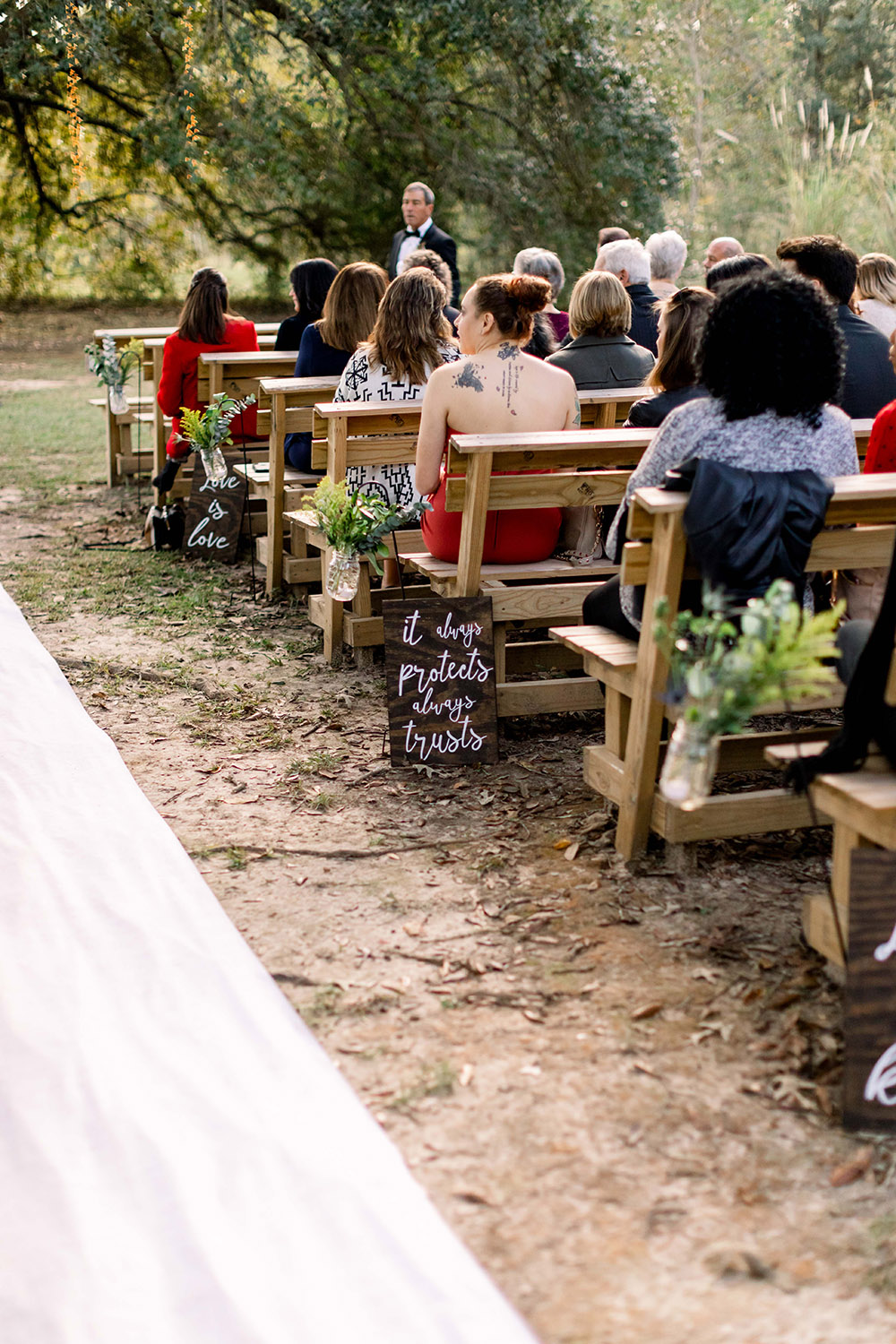 the wedding aisle lined with signs 1 Corinthians 13