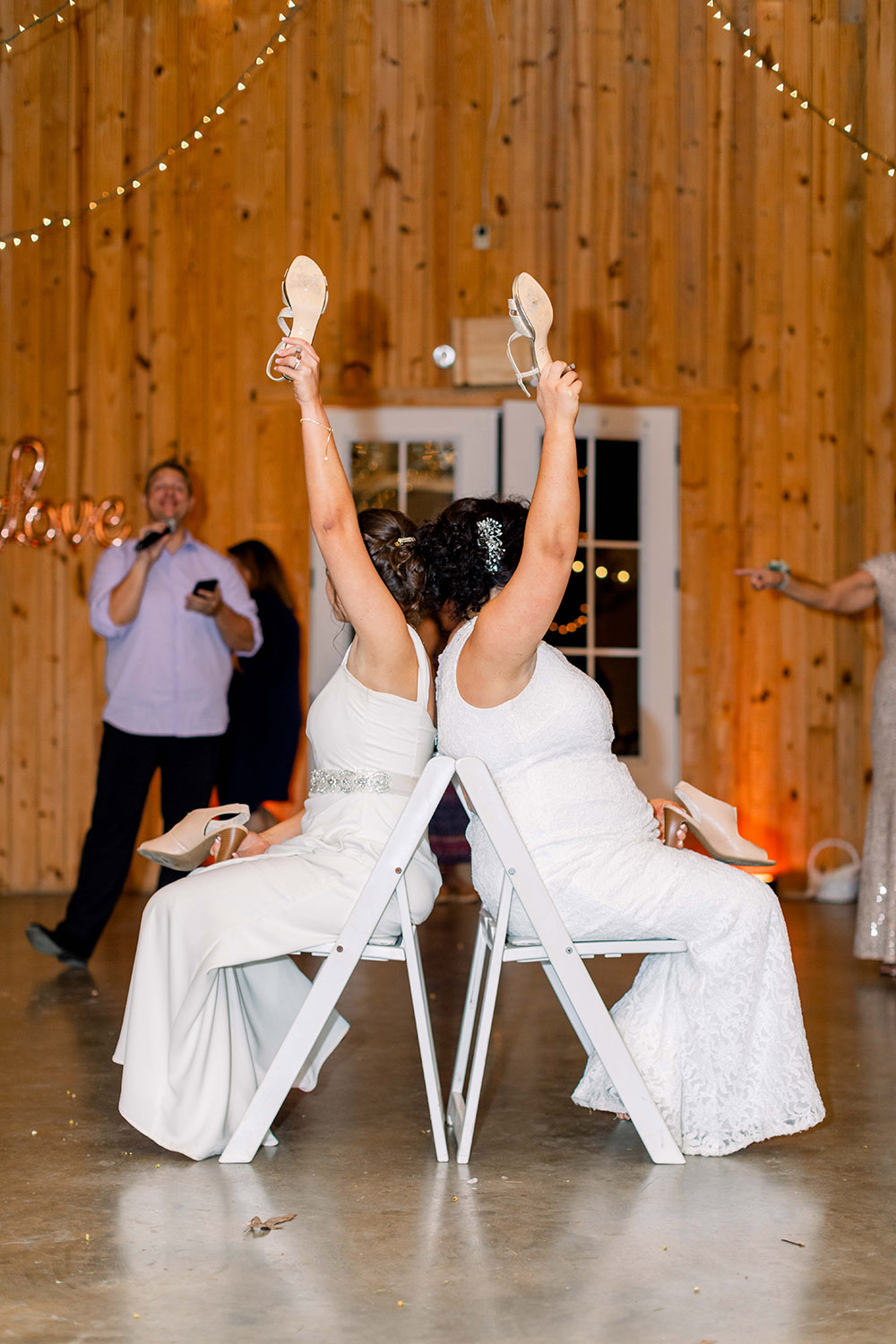 the brides play the shoe game at the wedding reception