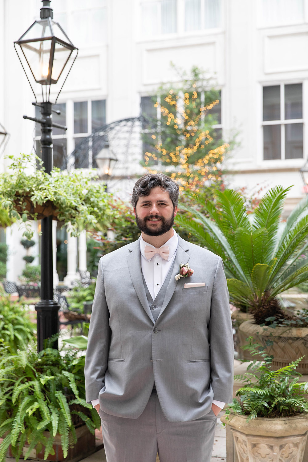 groom in ritz-carlton new orleans courtyard