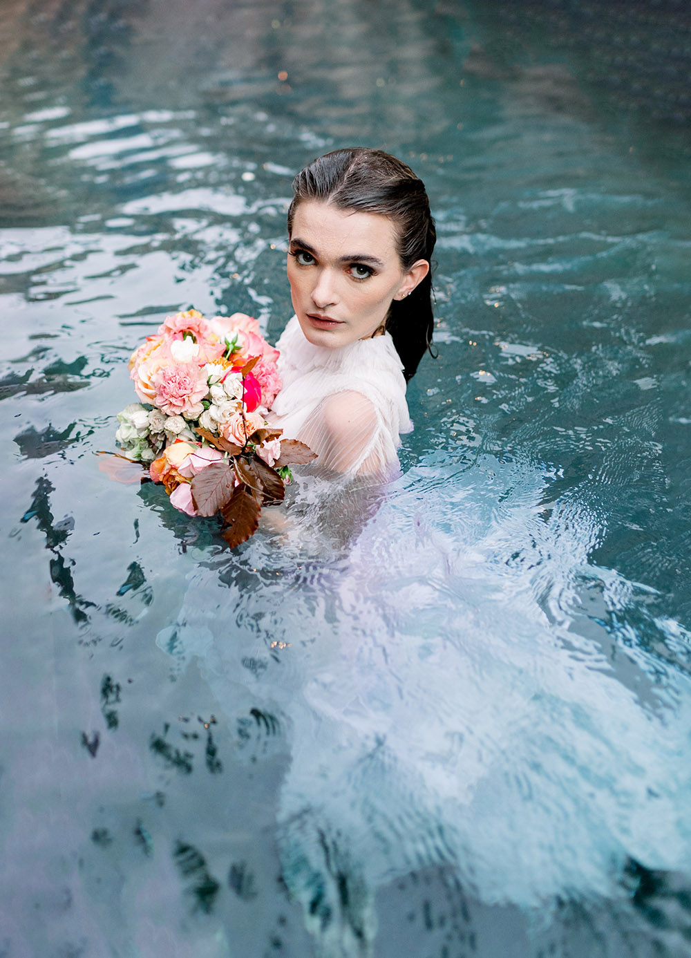 bride in swimming pool