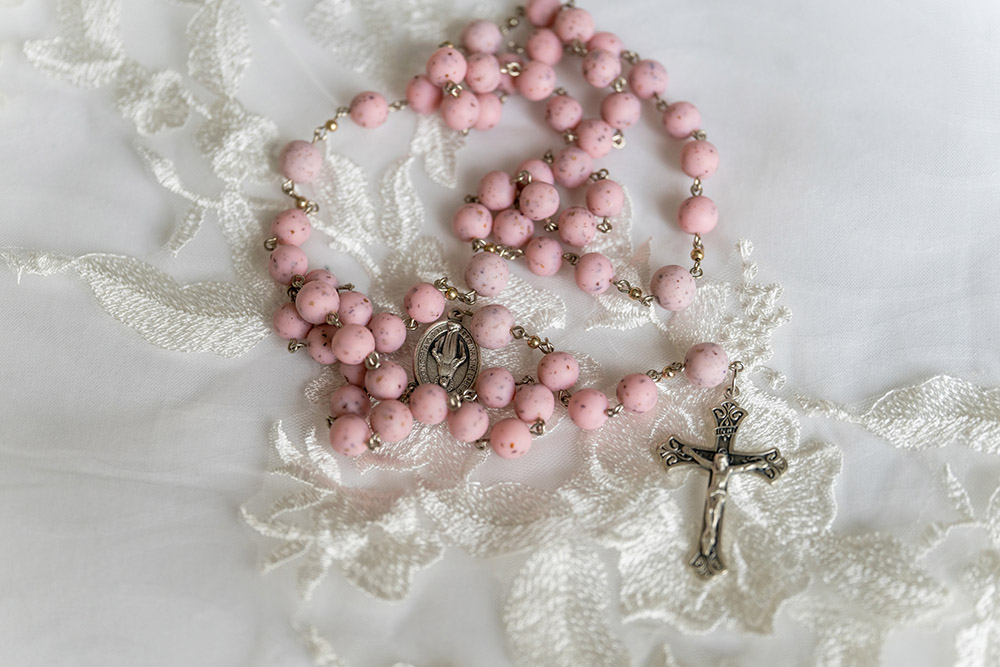 pink rosary made from flowers