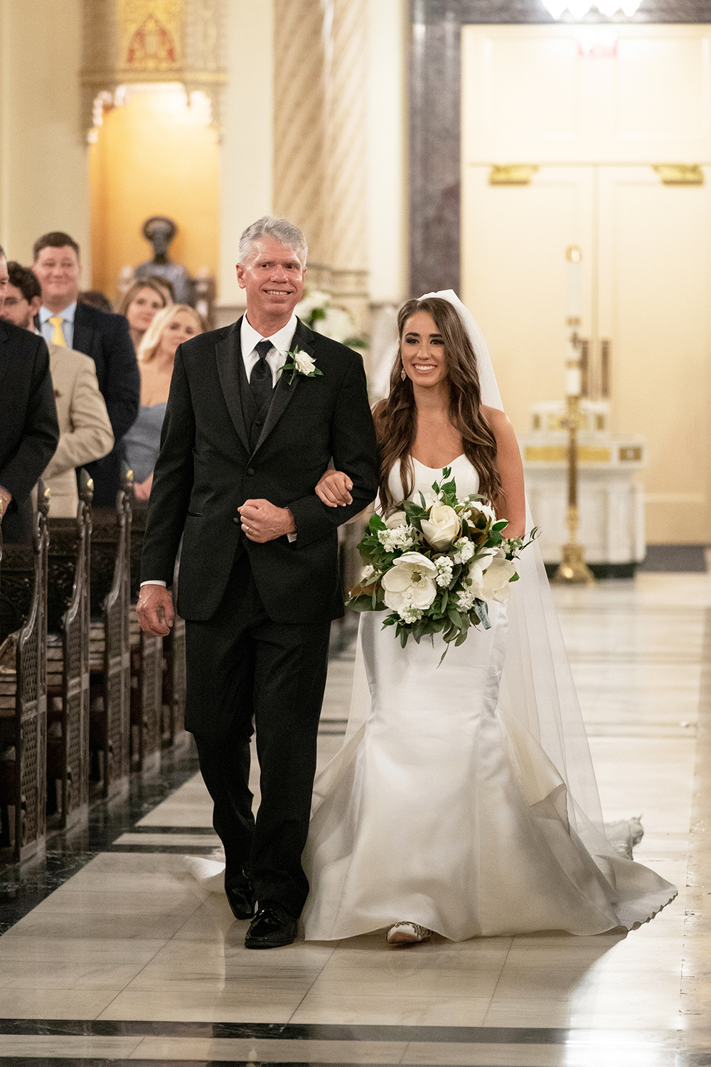 Amanda and her father walk down the aisle