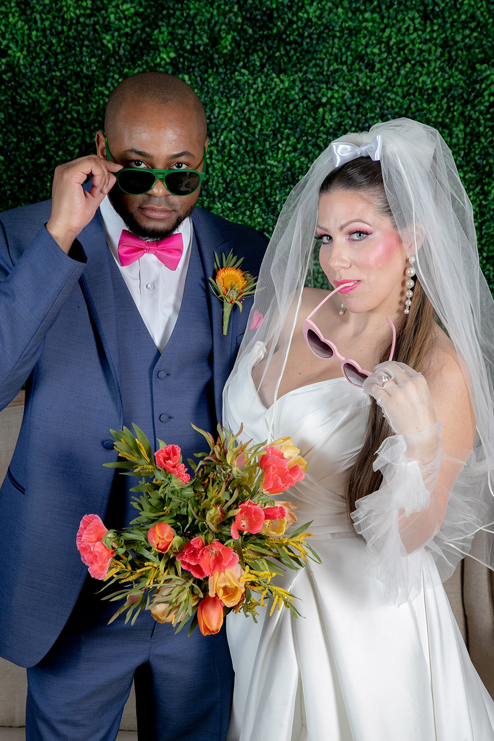 bride and groom with sunglasses