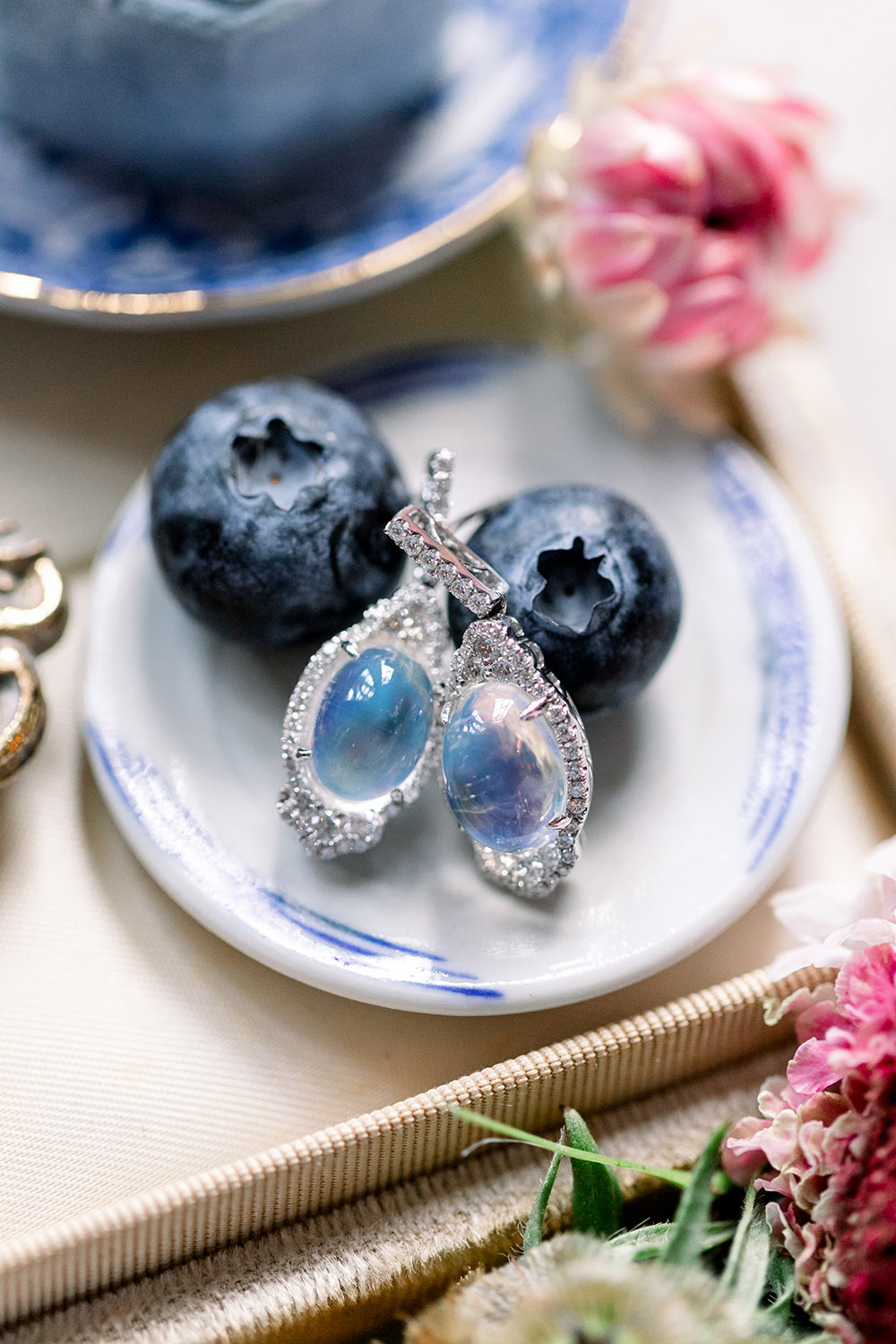 White Gold 10.14CT Blue Moonstone Earrings courtesy of Boudreaux’s Jewelers