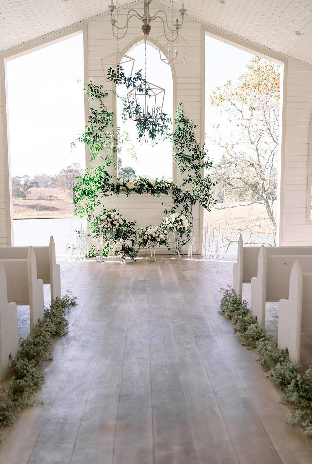 The White Magnolia Chapel decorated in greenery and baby's breath