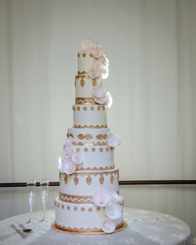 Harry only eats red velvet cake, so Dewanna made sure their 7-tier wedding cake had red velvet and chocolate layers in addition to the the traditional wedding cake flavor. Cake by Kupcake Factory | Photo by Prince Photography