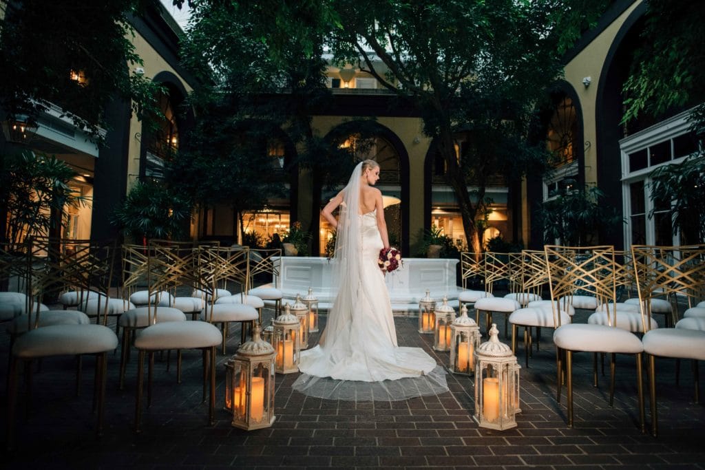 A bride in the courtyard of Hotel Mazarin. Photo: Gabby Chapin Photography