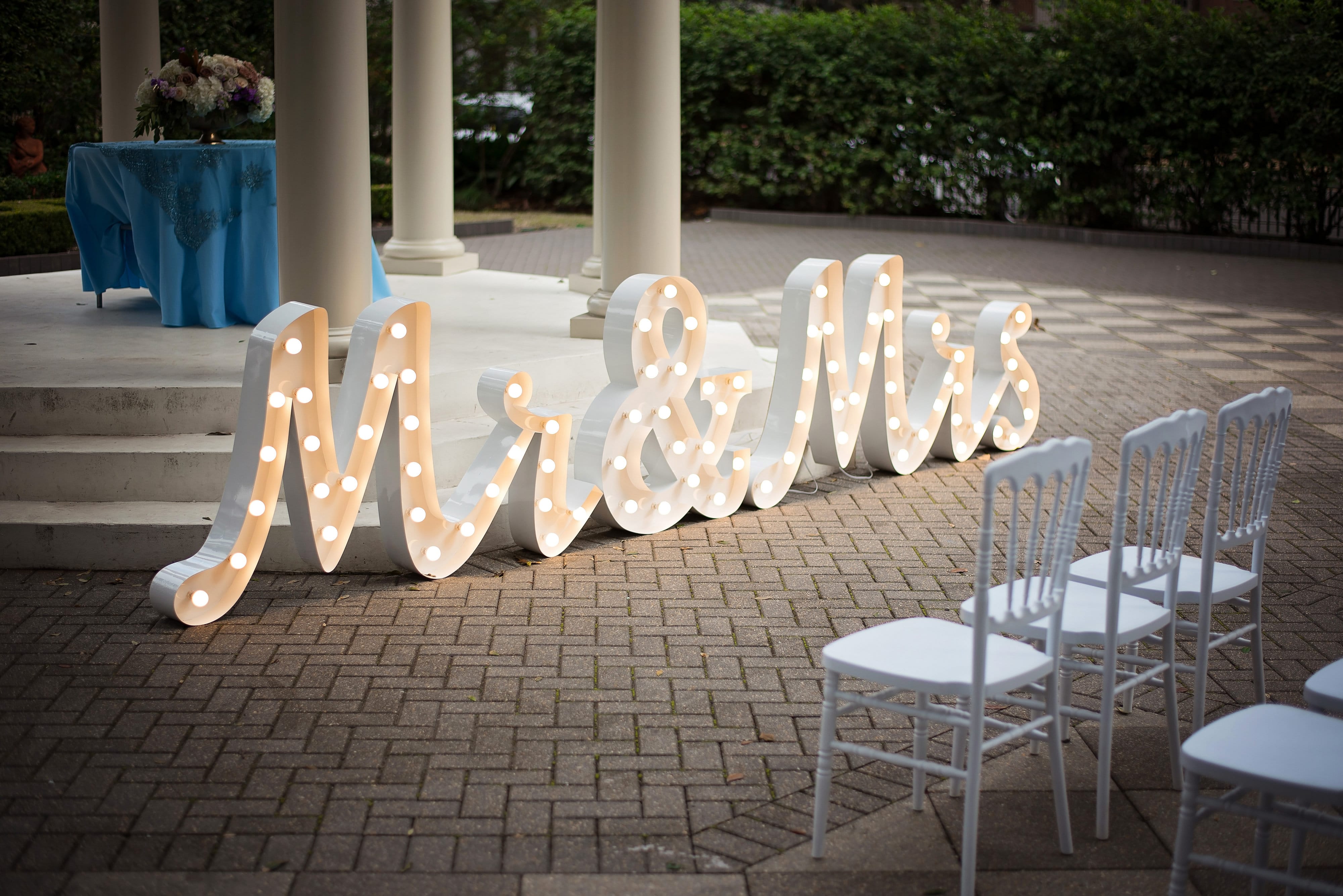 Announce your new union in lights! This script “Mr&Mrs” marquee is available from True Value Rental. Photo by The Crawfords.