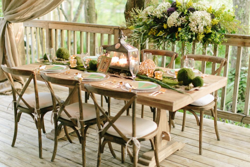 Farmhouse table set for a wedding reception dinner.