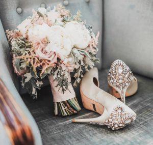 A bridal bouqueht and oes on a chair.