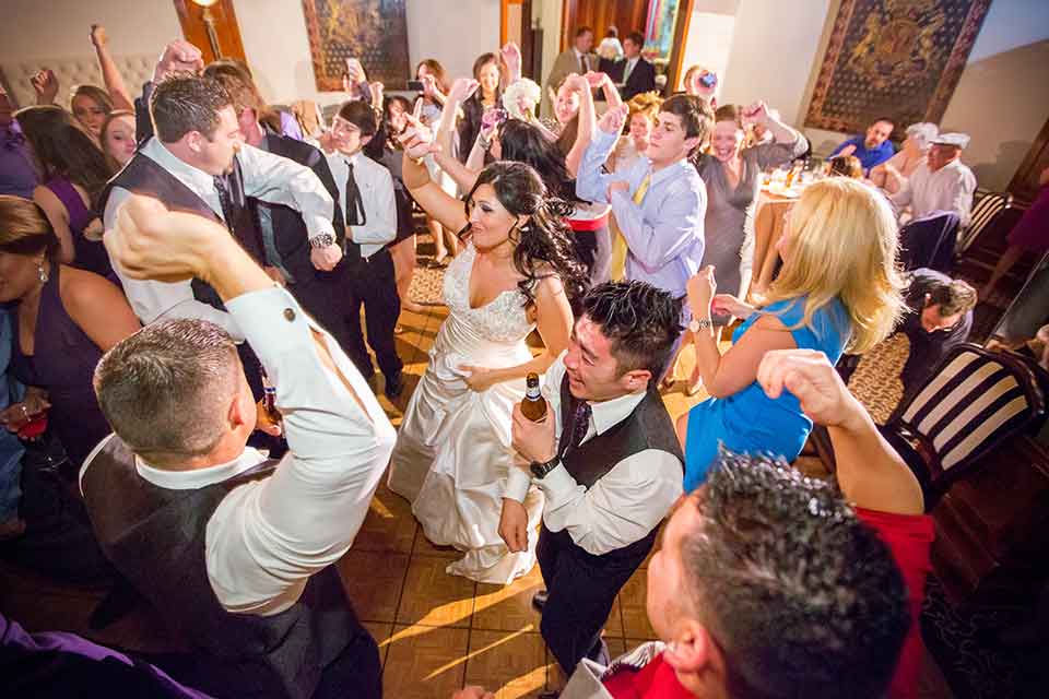 A bride and guests dance at a wedding reception dj'd byAaron Lane Pro DJ | Photo: Adam Falgout