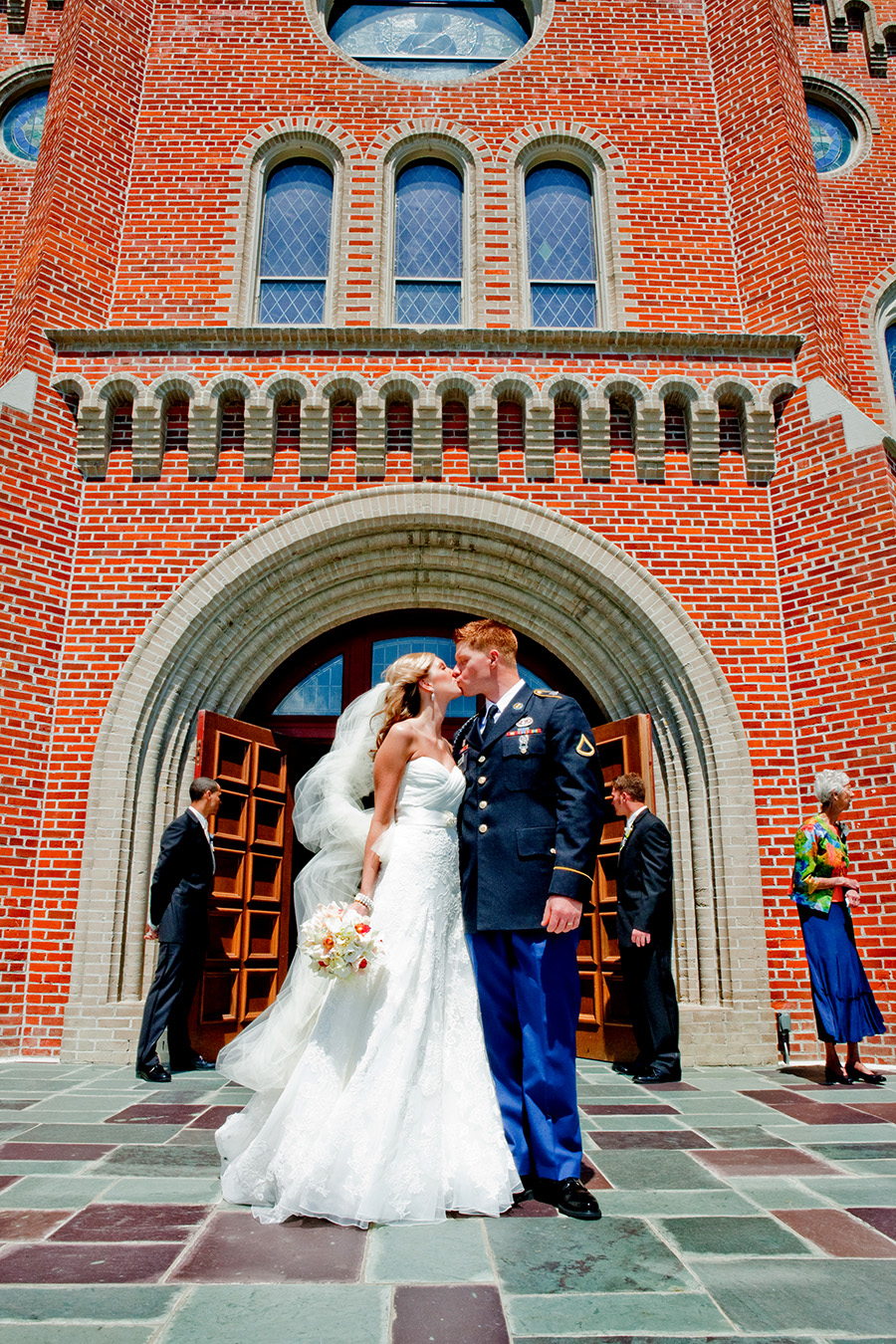 Bride and Groom kissing outside of church