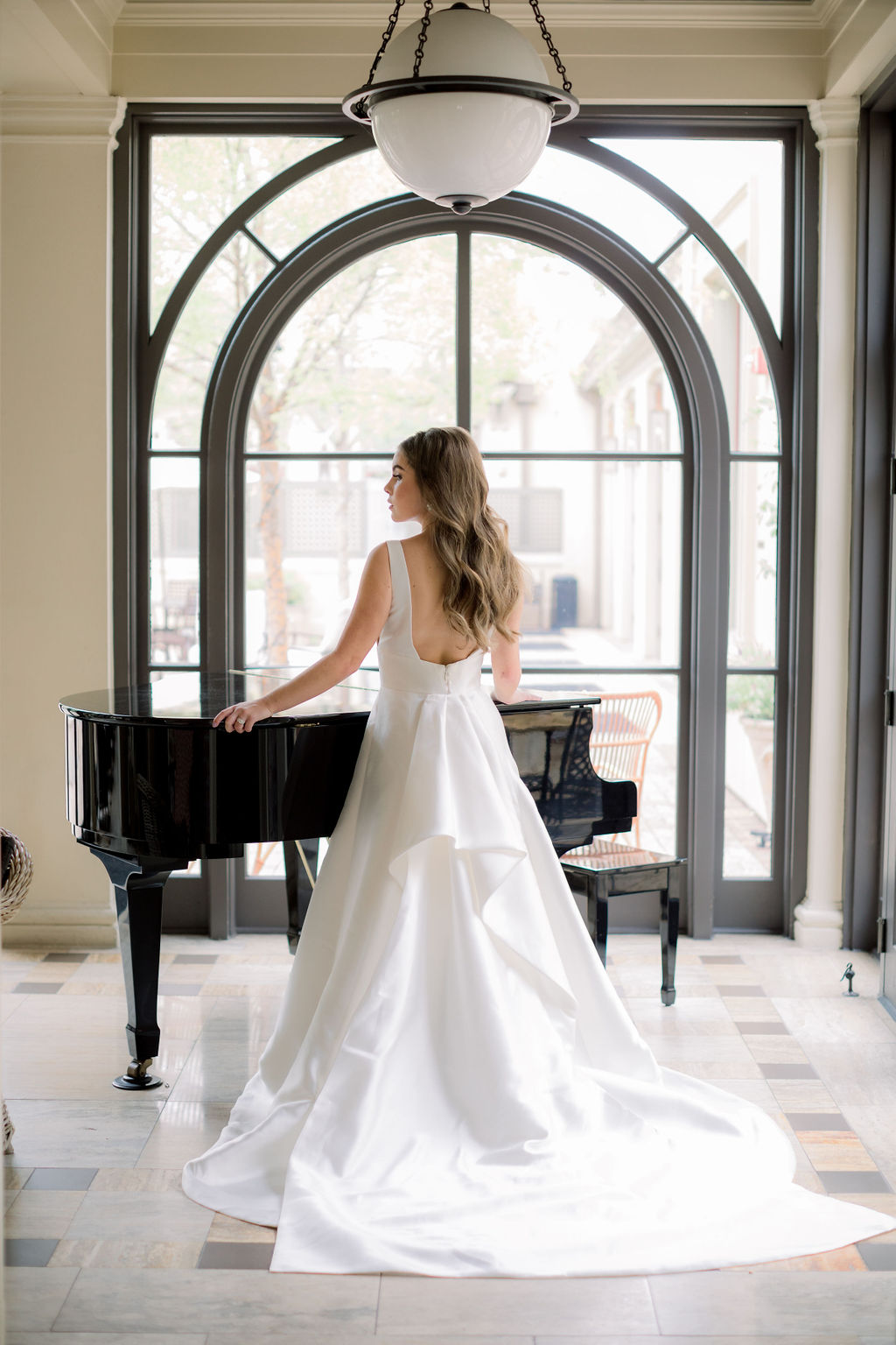 Bride wearing silk crepe bridal gown from I Do Bridal Couture. Photo: Emily Songer Photography