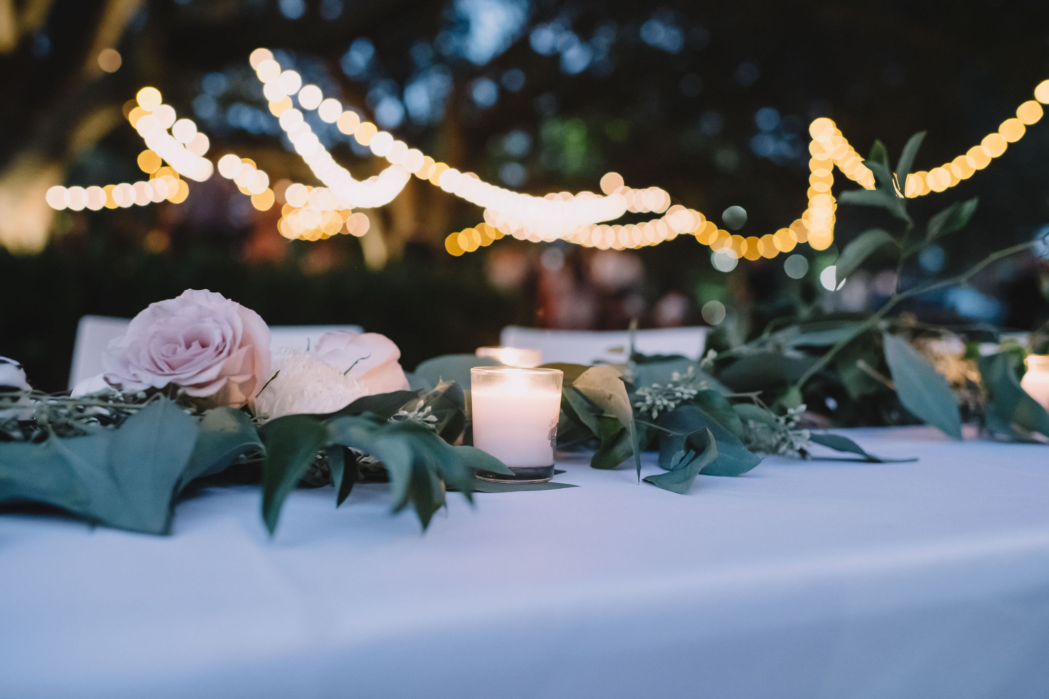 Greenery and candles decorated the reception tables. Photo by Rare Sighting Photography