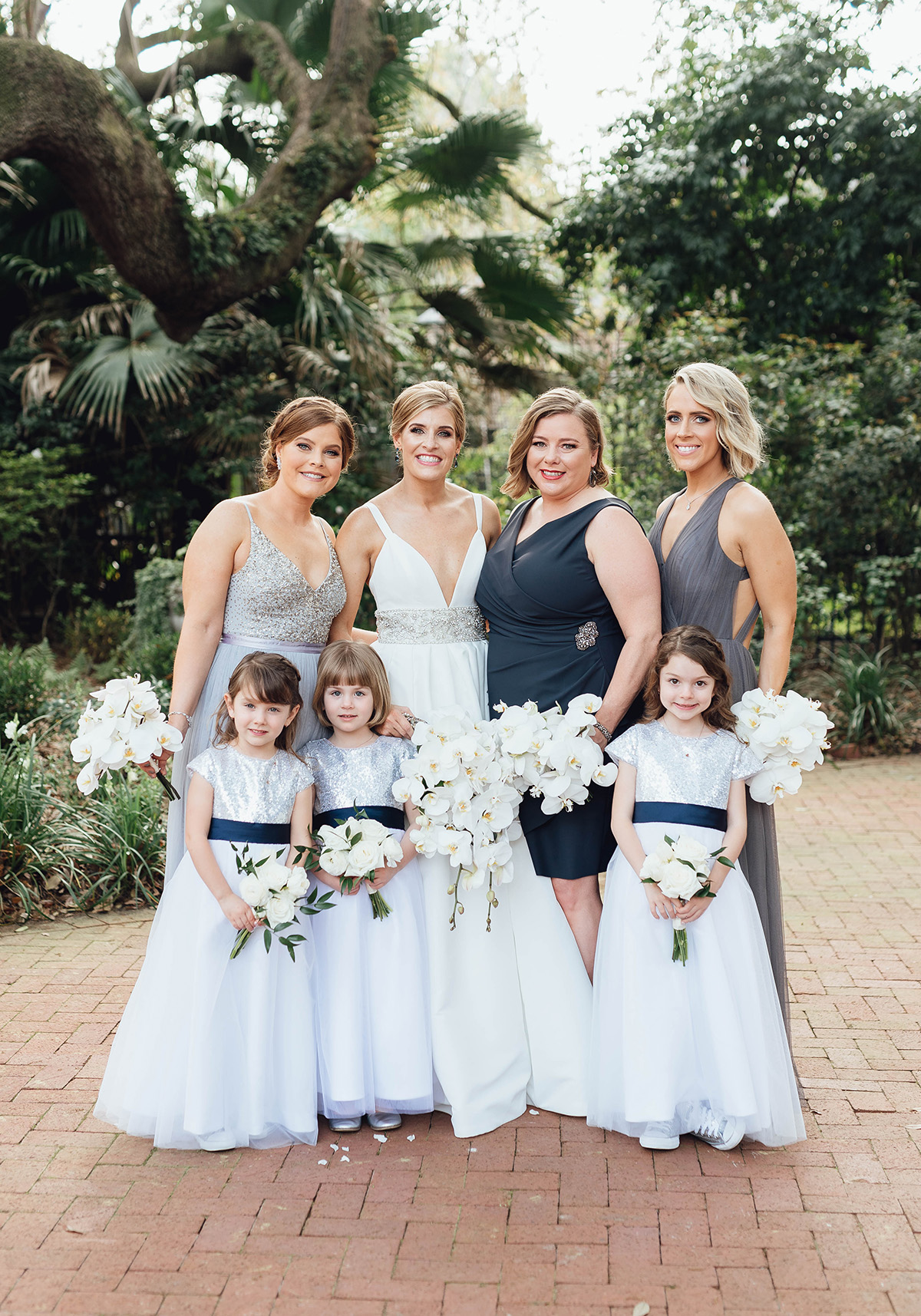 bride with bridesmaids and flower girls