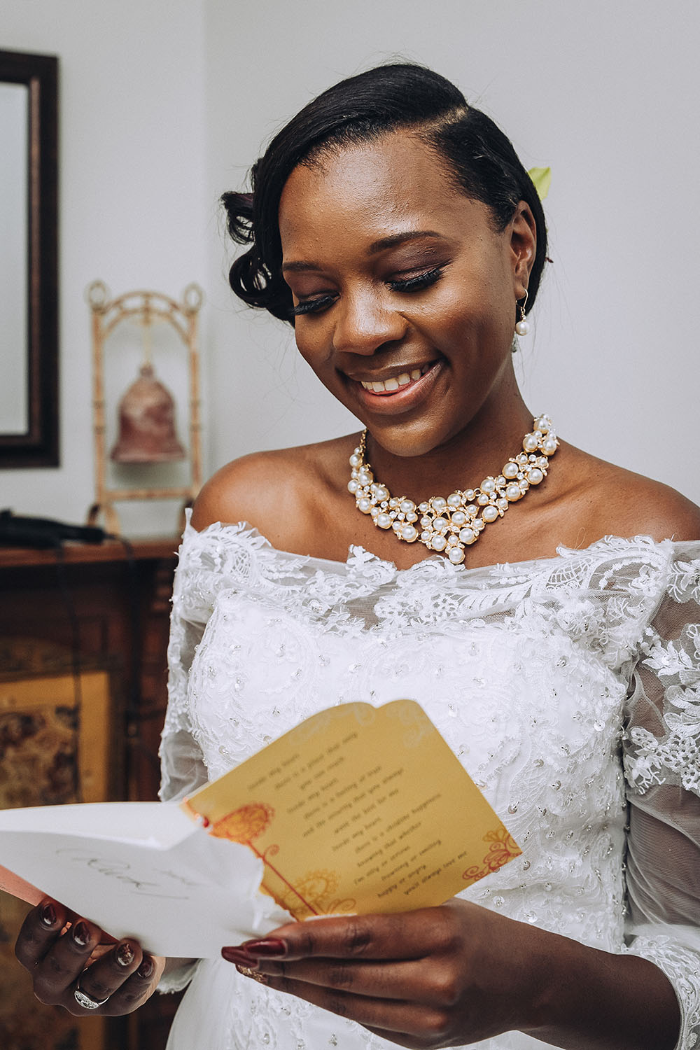 Bride reading a card on her wedding day