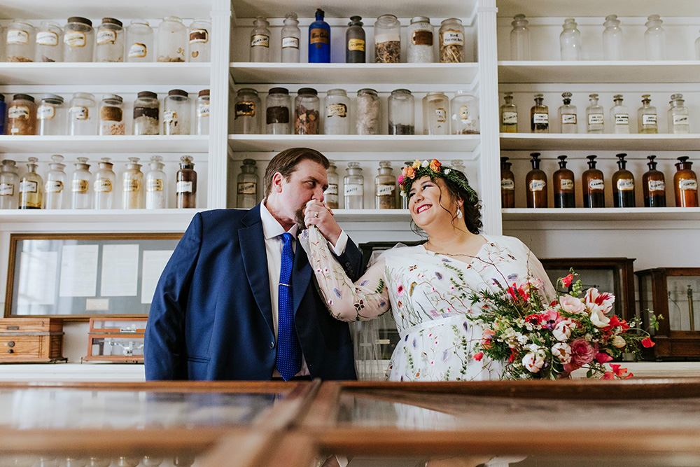 Peter and Del pose for photos at The Pharmacy Museum before their ceremony. Photo: Ashley Biltz