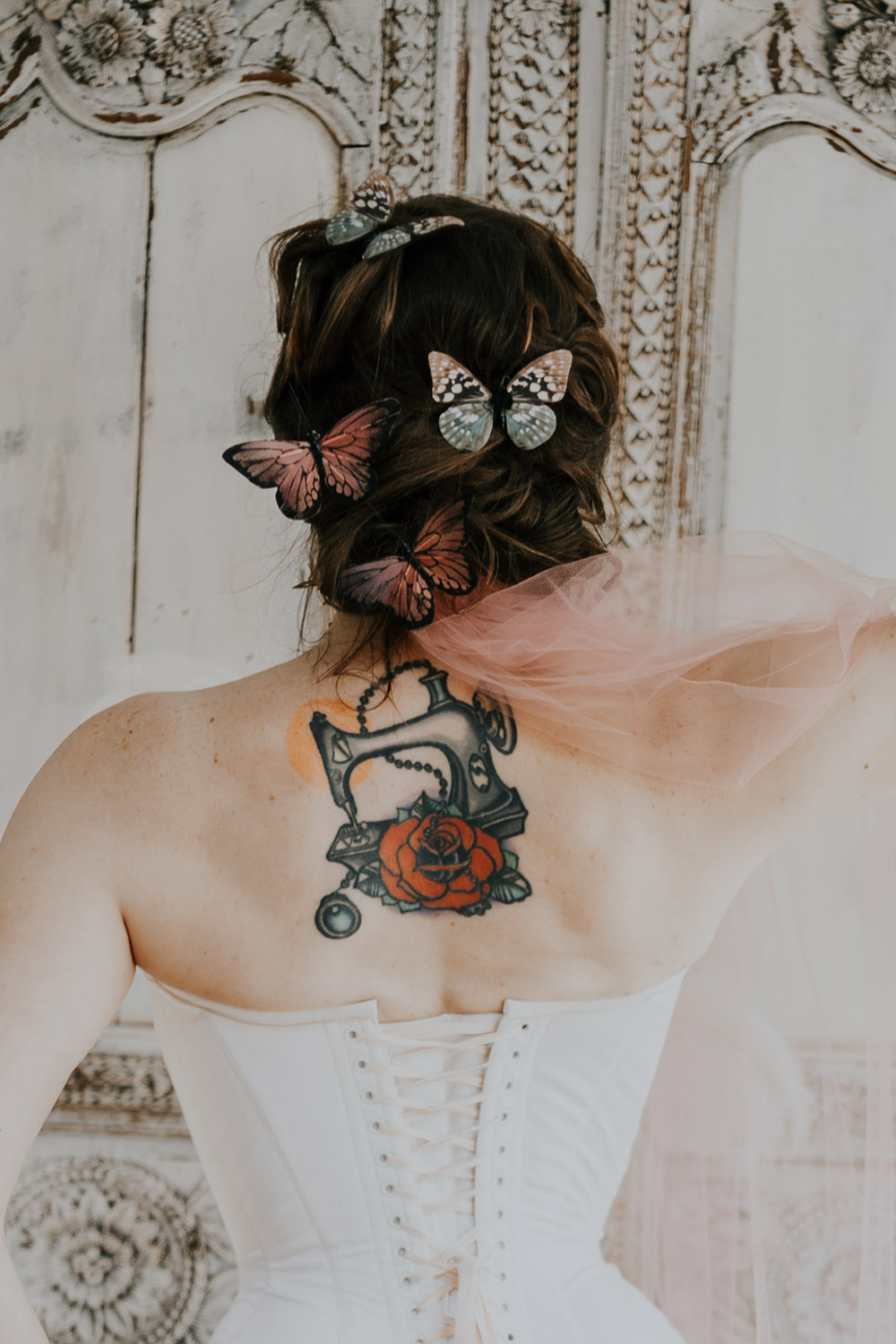 Back view of the bride's hair with butterflies