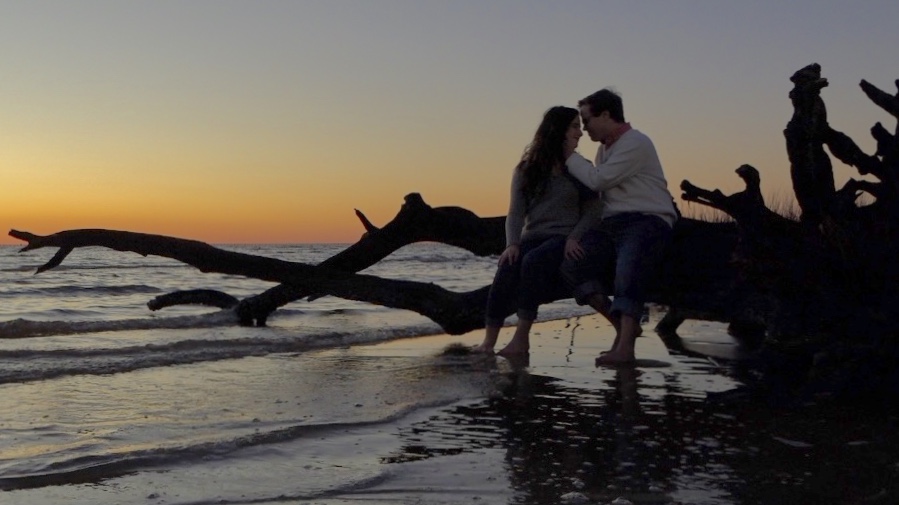 engaged couple on a beach