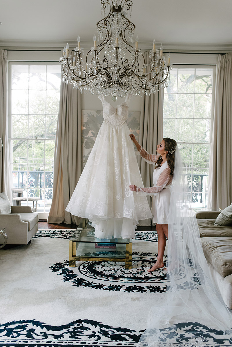 A bride and her wedding gown at the Jon Vaccari House in New Orleans | Photo: Studio Tran