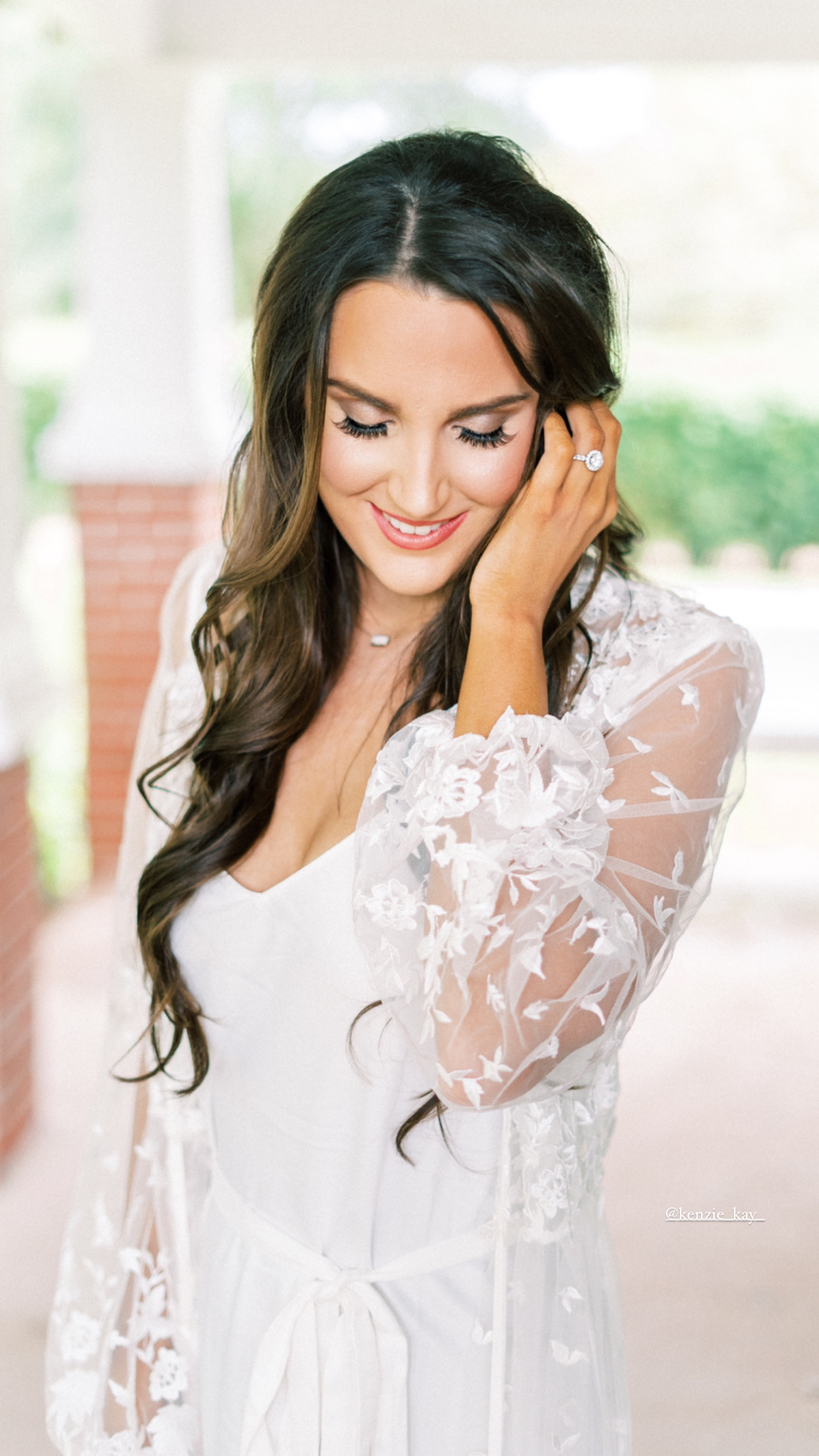 Bride on wedding day in lace robe