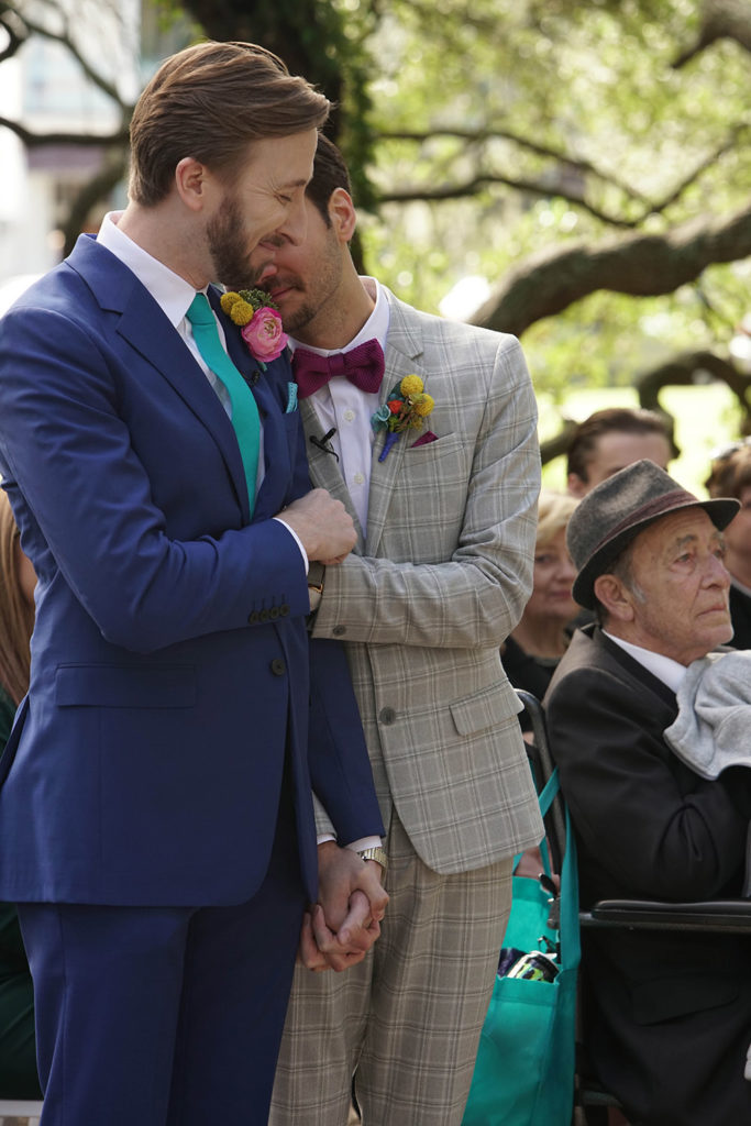 the grooms embrace during the wedding ceremony