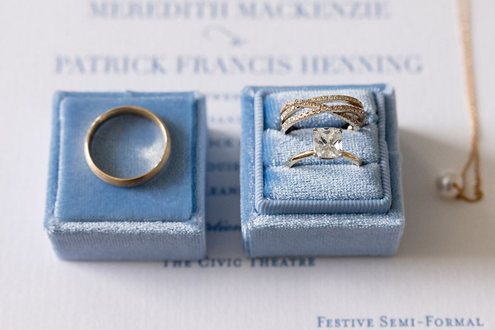 the wedding rings in a blue velvet box