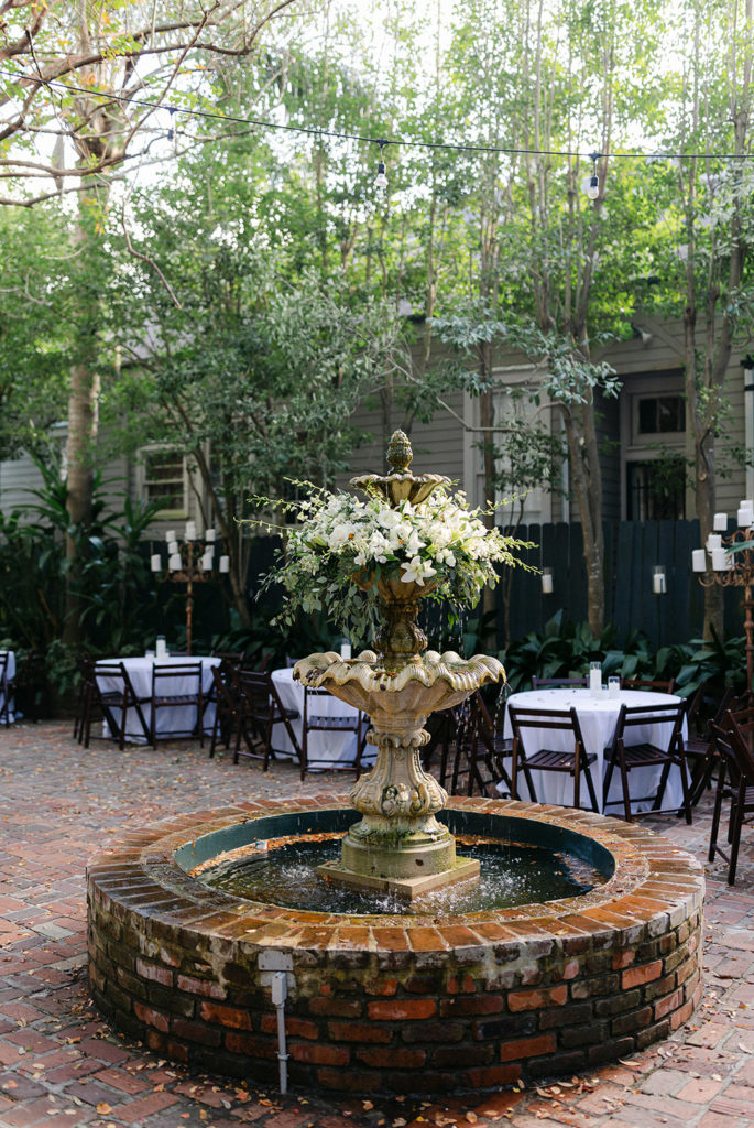 Terrell House courtyard fountain decorated with fresh flowers
