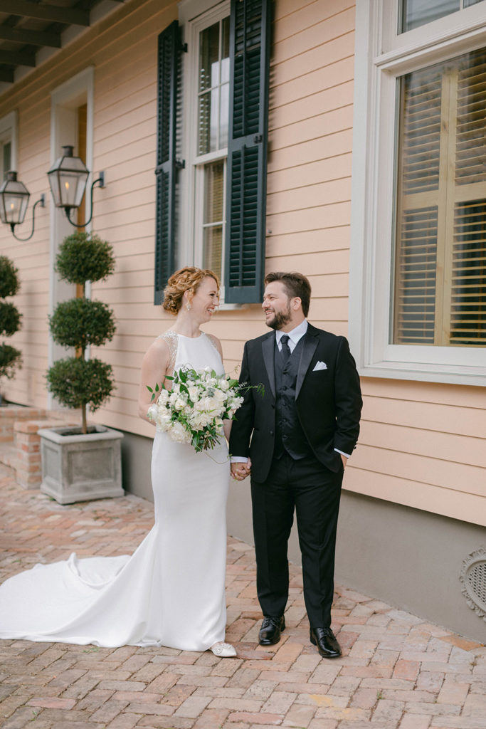 the bride and groom take photos in uptown new orleans
