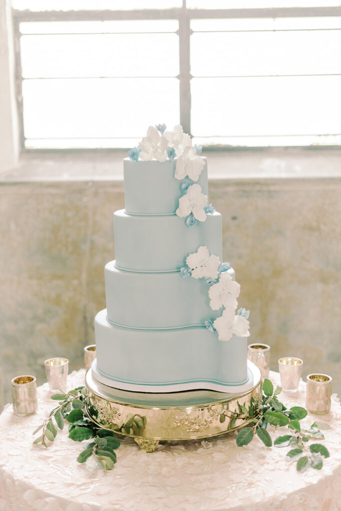 blue fondant paisley wedding cake with white sugar flowers