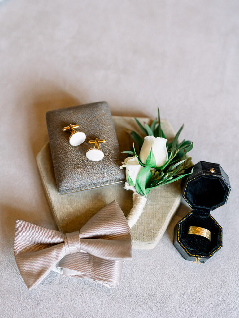 Bowtie, cuff links, boutonniere and wedding ring