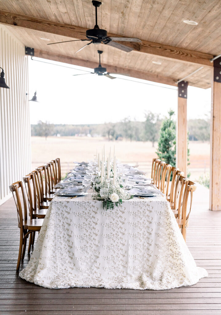 Wedding reception table on the porch of The White Magnolia