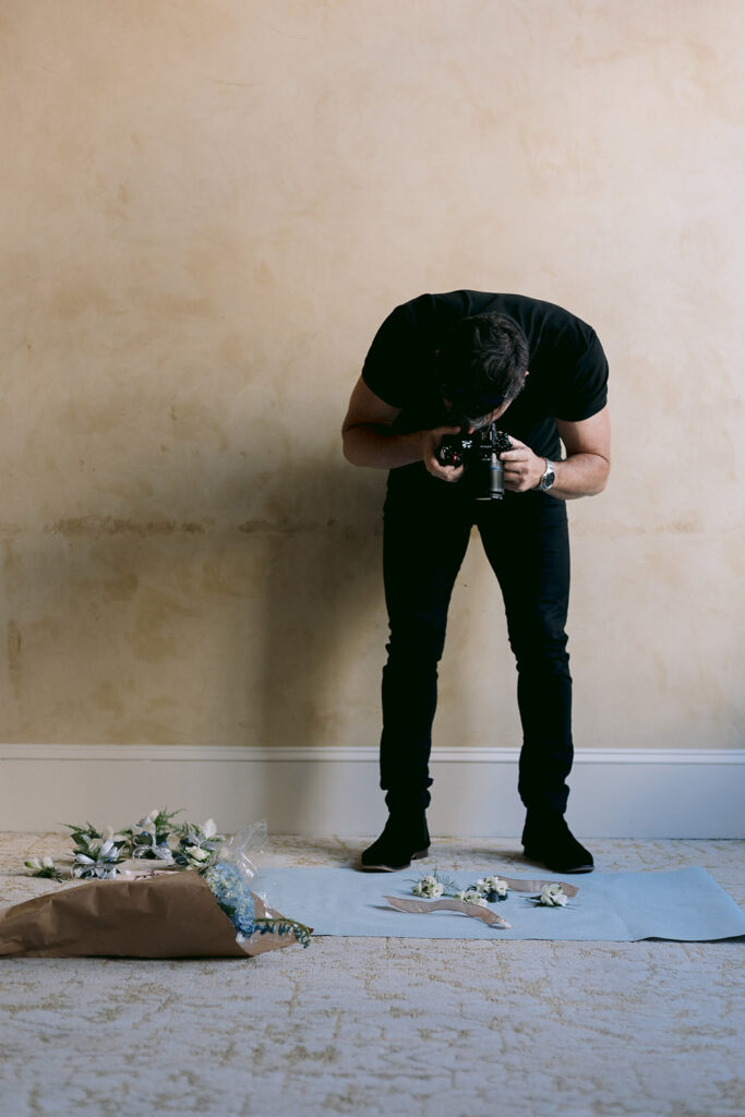 Photographer Andrew Alwert photographing a detail flat lay.